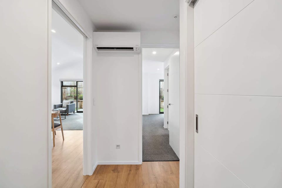 Central hallway with heat pump and clean design.