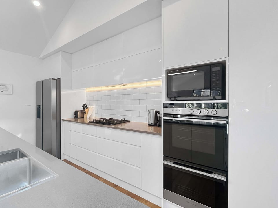 Fully equipped modern kitchen with sleek finishes