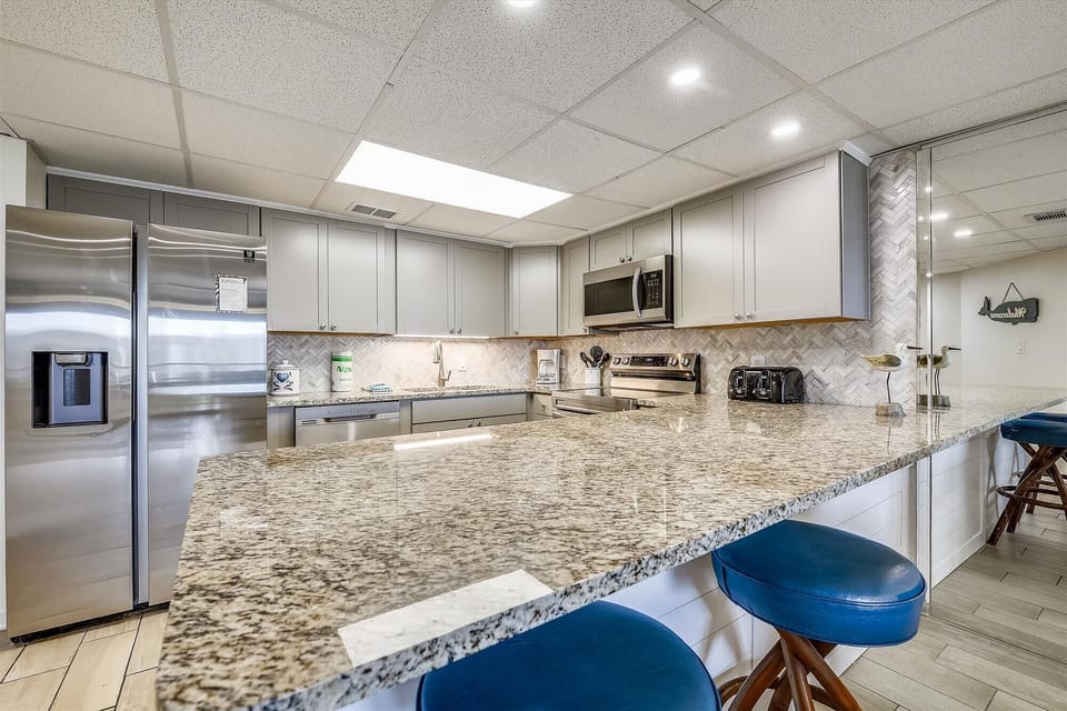 Completely renovated kitchen  with new appliances with bar seating for 2