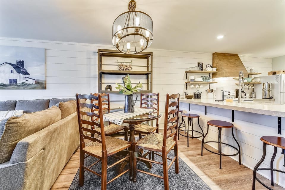 Round glass dining area that seats four