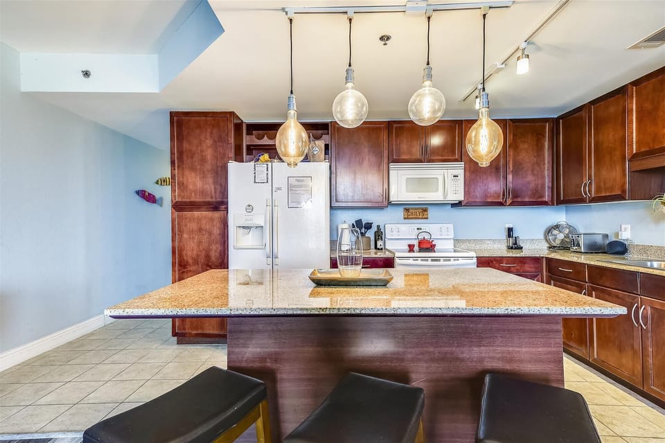 Large spacious kitchen with island seating, Keurig and full stocked to cook all your meals in the unit if you want!