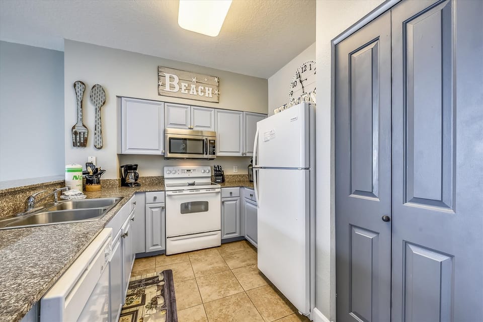 Tiled kitchen with custom built cabinets
Standard coffee pot and Keurig