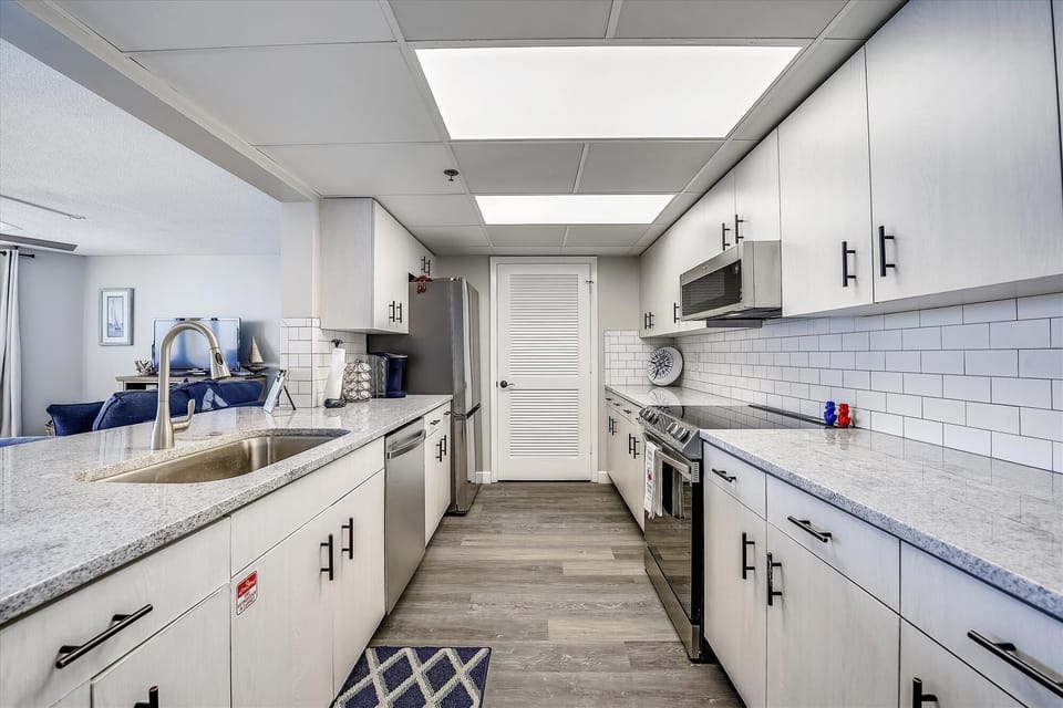 Tiled kitchen with laminate floors