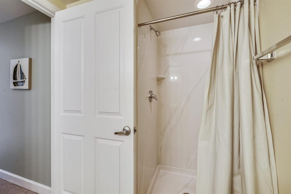 Standup shower in the bathroom adjacent to the bunk area