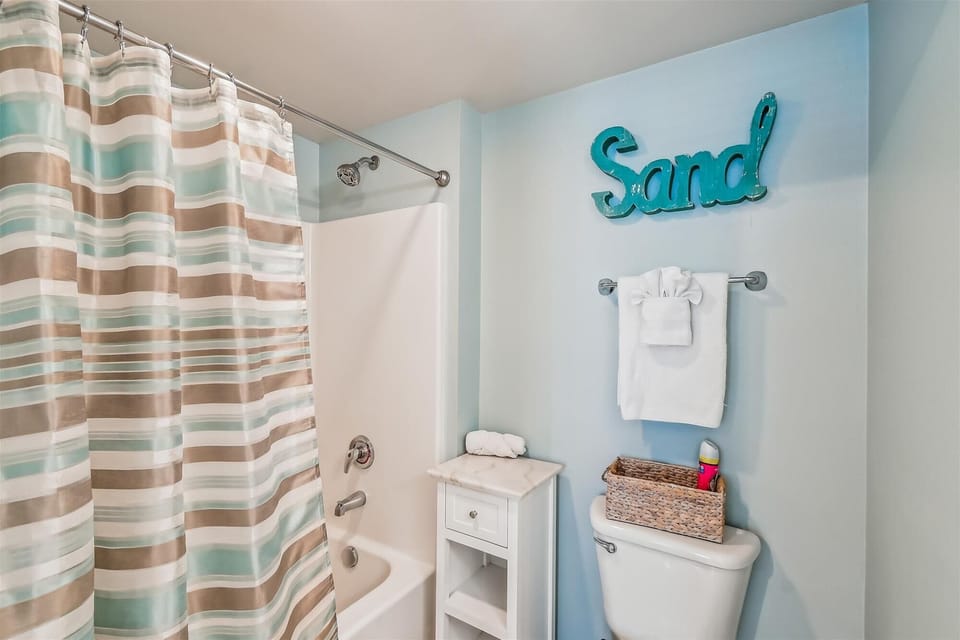 Master Bathroom with tub Shower combo and toilet area