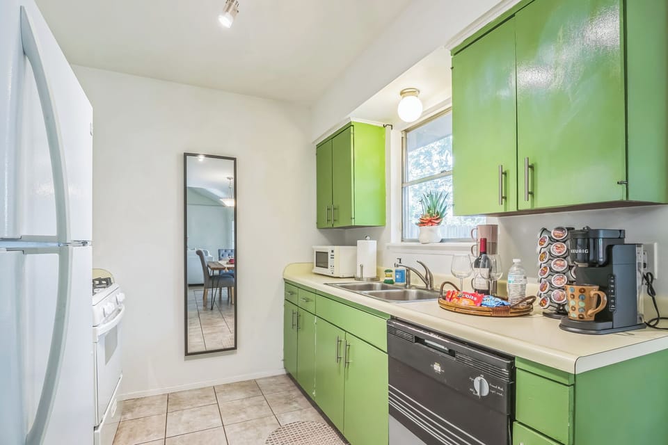 Microwave, toaster, gas stove, dishwasher, pots, pans, utensils,
