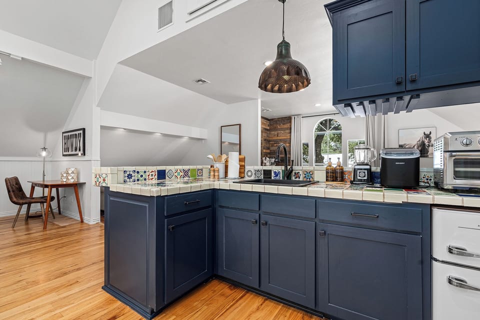 The countertop comes fully equipped and ready—everything you need for quick meals, drinks, and snacks at Wimberley Treehouse.