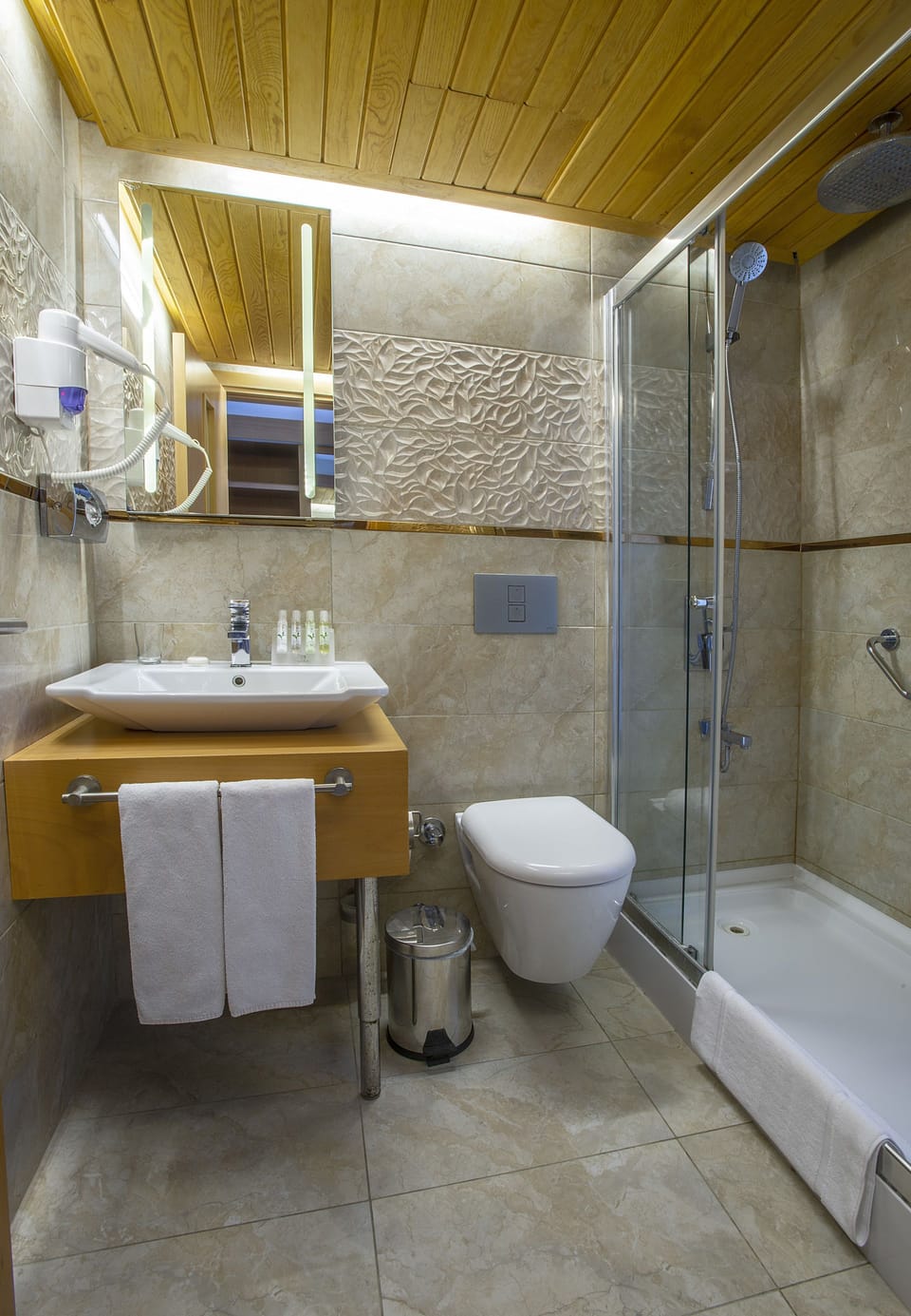 Shower, hair dryer, slippers, towels