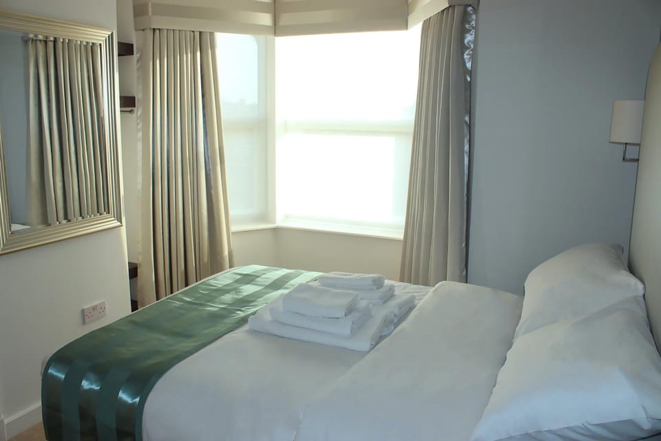 Blackout drapes, free WiFi, bed sheets