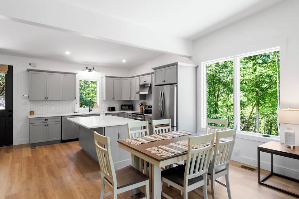 Open-concept living space with dining for 6, cozy seating, and a Smart TV for streaming