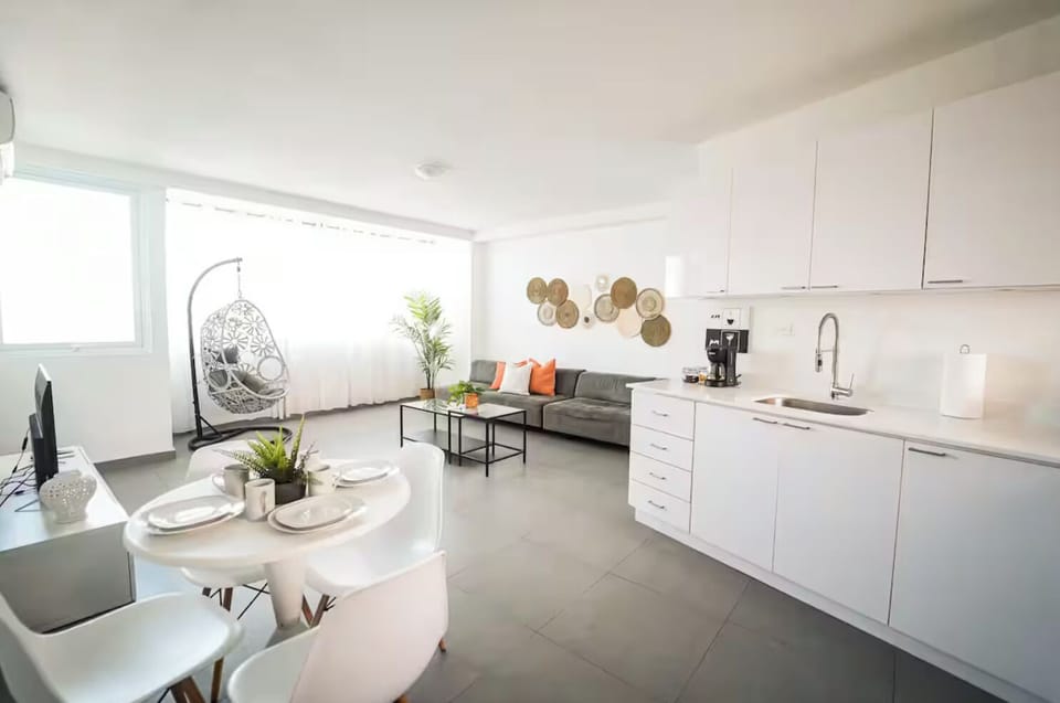 Kitchen, dining room and living area all open to each other. 