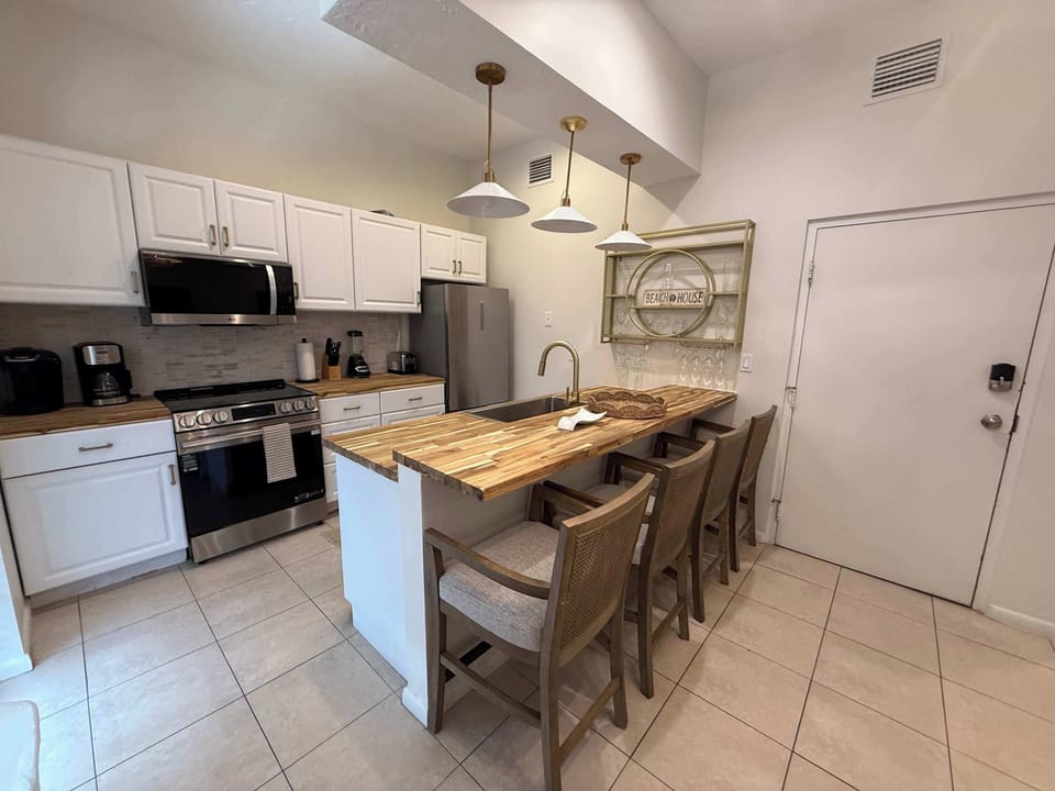 Kitchen with bar seating for 4. 