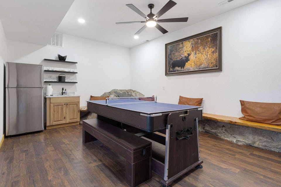 There is a full sized refrigerator and sink, along with bar equipment so you can enjoy the game room.