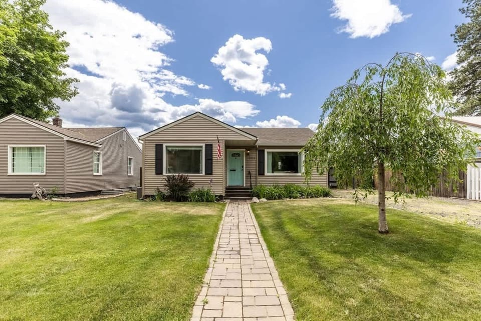 Front of home with long driveway with plenty of parking