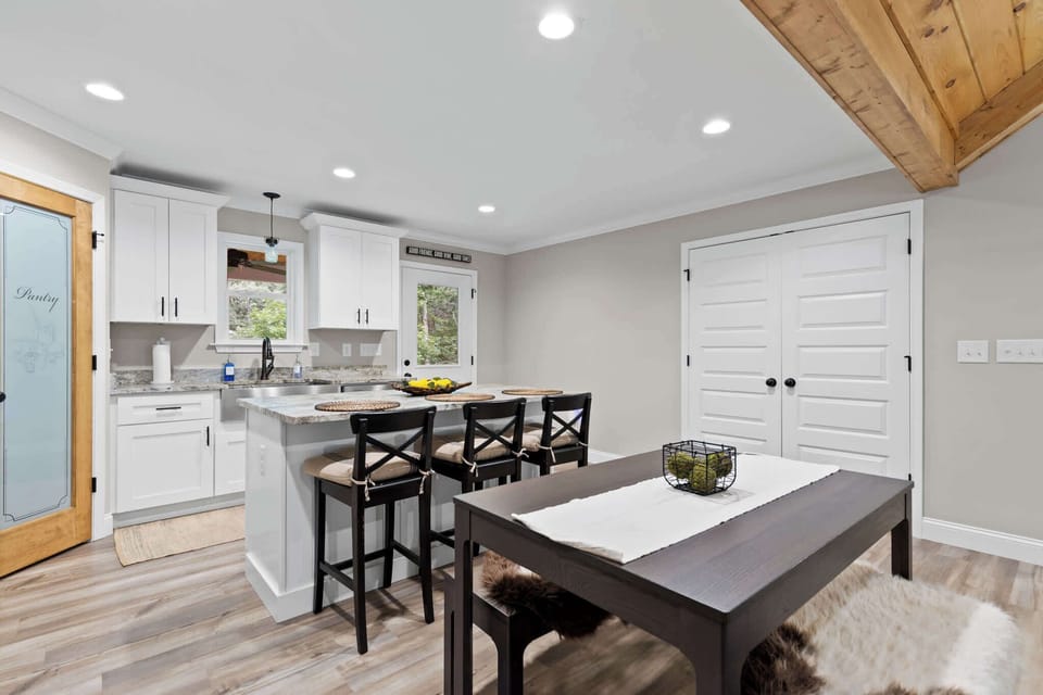 Enjoy meals in the cozy dining area just steps from the kitchen — perfect for easy serving and family gatherings.