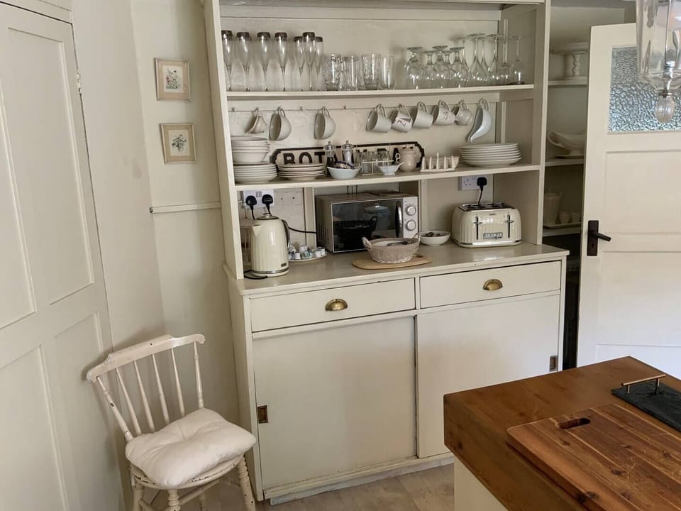 Kitchen - Electric range, cafetiere, butlers sink, fridge freezer, microwave, ketttle and toaster.  The washing machine can be found in the utility area.