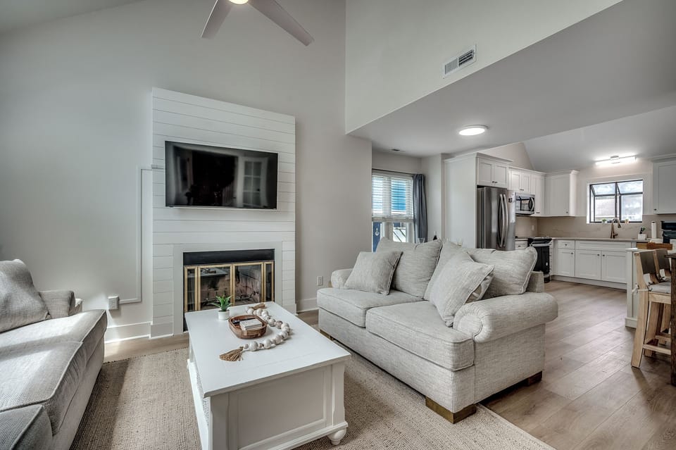 Open, airy, and oh-so-inviting! Relax in the cozy living room while staying connected to the stylish kitchen just steps away.