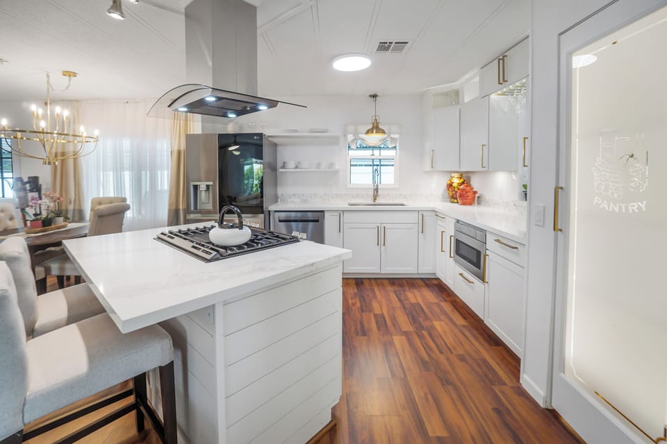 Chef's kitchen with quartz island, gas cooktop, and premium finishes