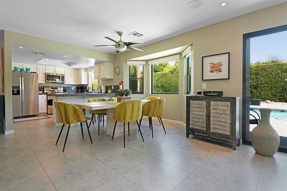Bright dining area with pool access and open kitchen layout