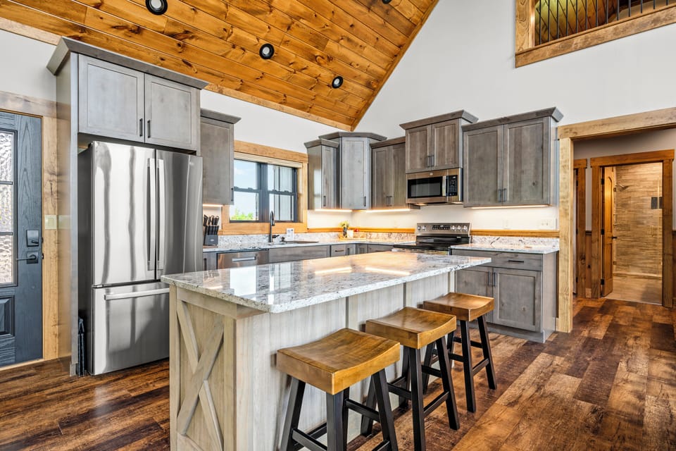 Extra bar stool seating at the kitchen island. 