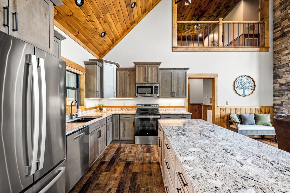 Fully equipped kitchen with stainless steel appliances. 