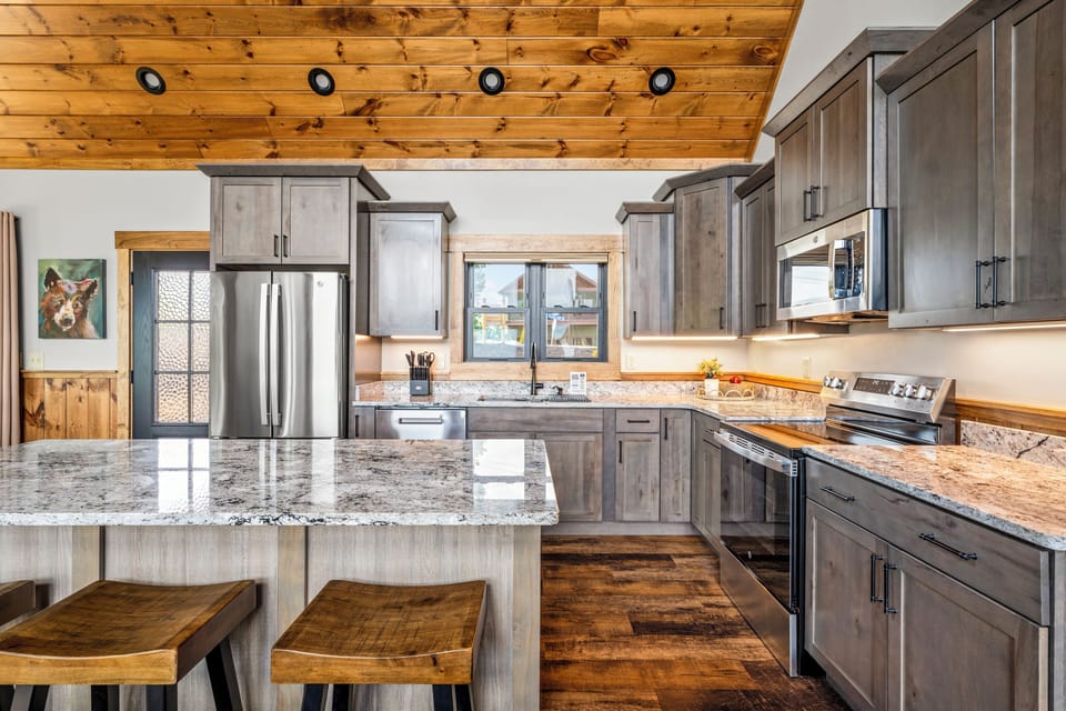 Fully equipped kitchen with stainless steel appliances. 