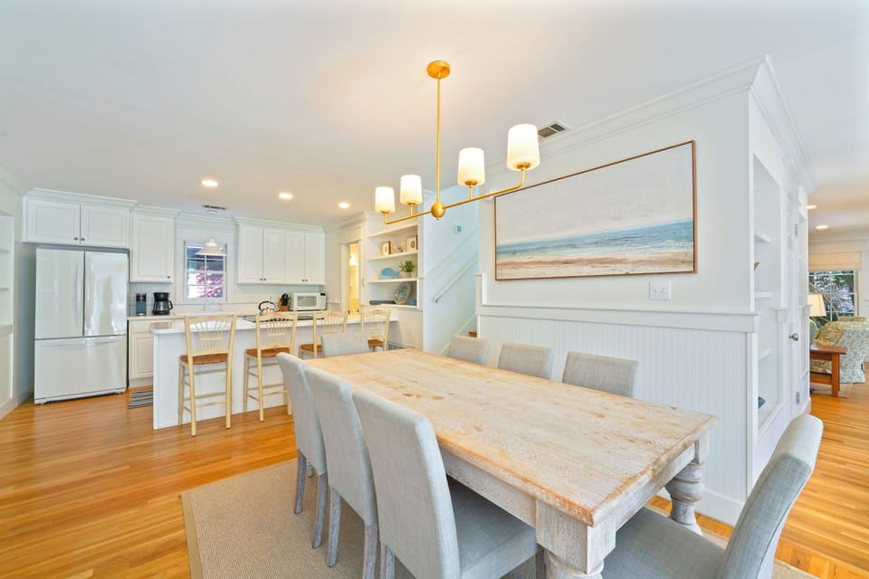 ADJACENT ENTRANCE VIEW OF DINING AND KITCHEN FROM LIVING