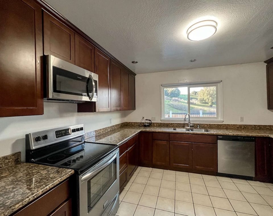 Large, well-equipped kitchen with ample counter space.