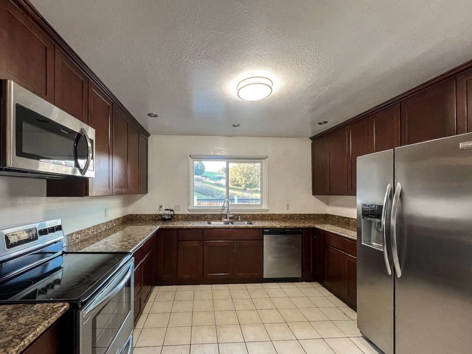 Modern and spacious kitchen area perfect for family meals and hosting.