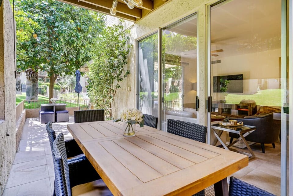 Enjoy meals with a view at the balcony dining table just outside the living room.