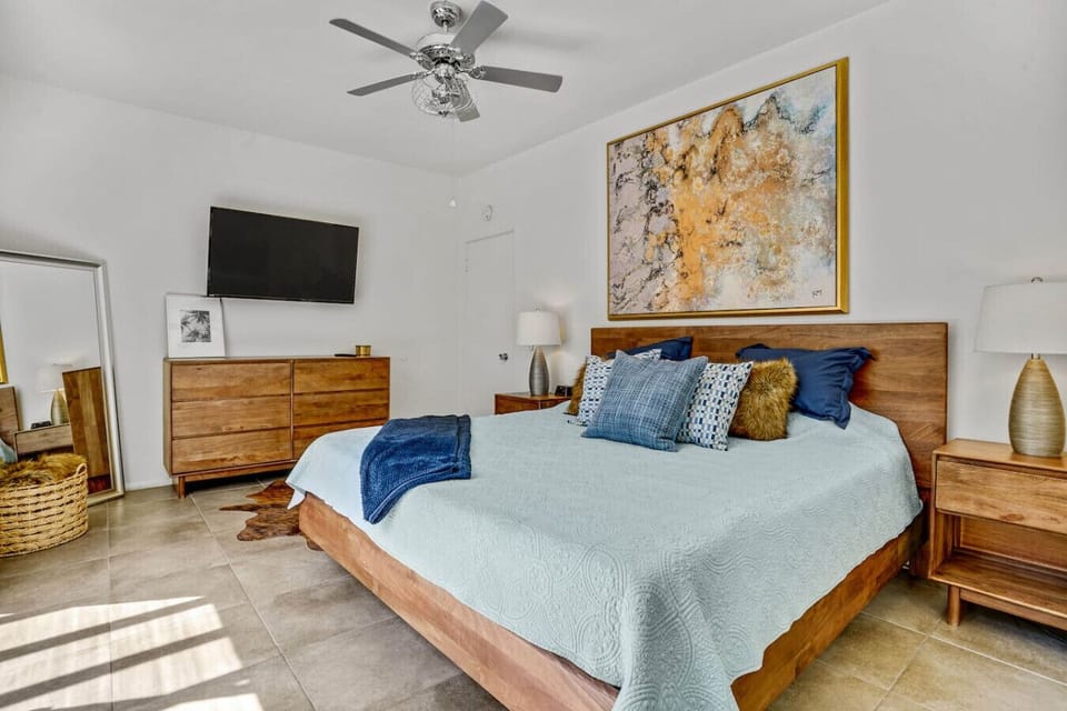 The bed is perfectly positioned for cozy in-bed movie marathons.