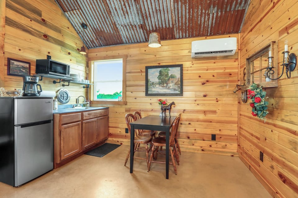 The cabin has a kitchenette and small dining area.