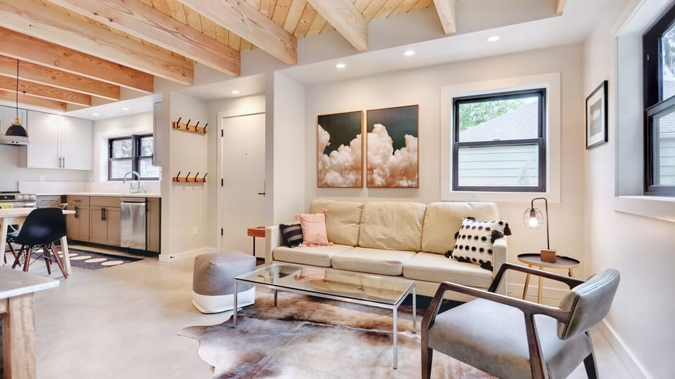 Hygge Vibes – Relax in this serene, Scandinavian-style living room with soft textiles and calming tones.