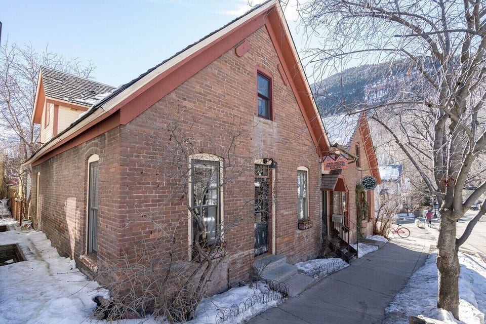 Exterior - A beautifully renovated townhome tucked into a charming historic building on South Oak Street—just one block from both the gondola and Telluride’s vibrant Main Street