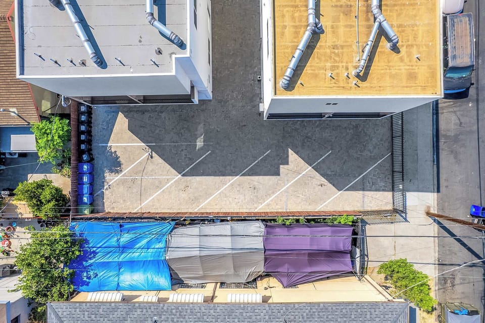 Overhead drone view of the property and surrounding homes.