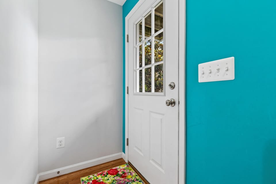 Bright entryway leading into a fresh, modern space
