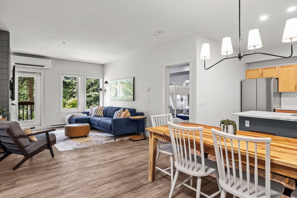 Spacious modern living room. Complete privacy surrounded with beautiful trees, south facing natural light and iconic mountains peaking through