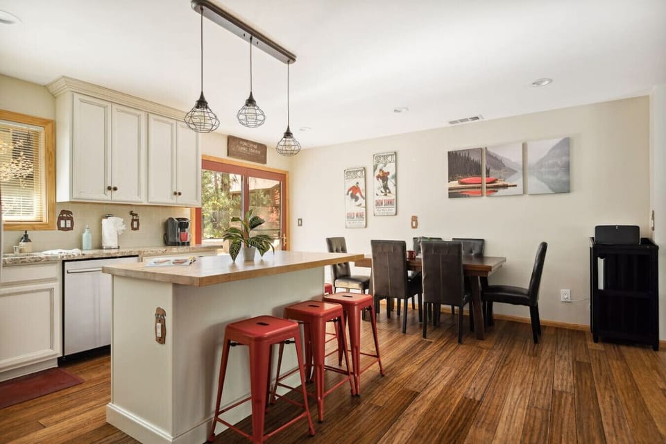 Additional seating is available at the bar in the open-concept kitchen and dining room area.