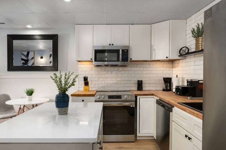 Fully equipped basement kitchen with full-size appliances—perfect for cooking meals, brewing coffee, or settling in like home.
