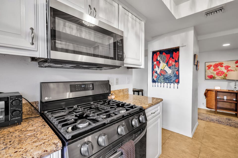 Modern kitchen with stainless gas stove and ample cooking space