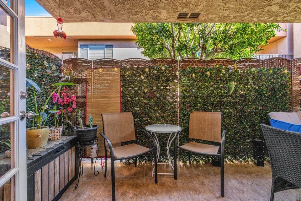 Covered patio retreat with string lights and garden-style decor