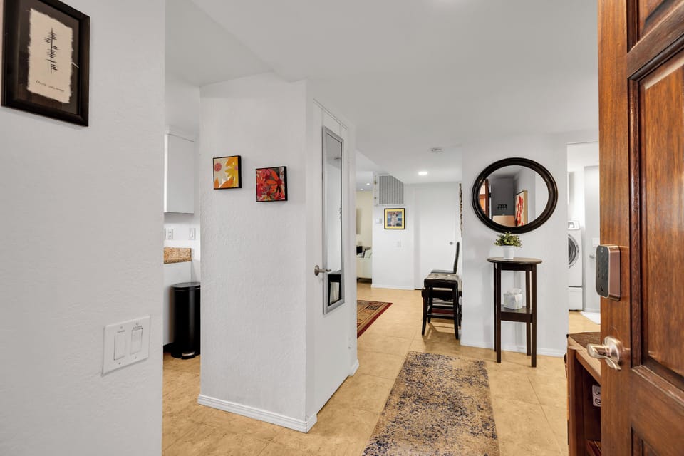 Bright entryway with keyless check-in, tile floors & in-unit laundry
