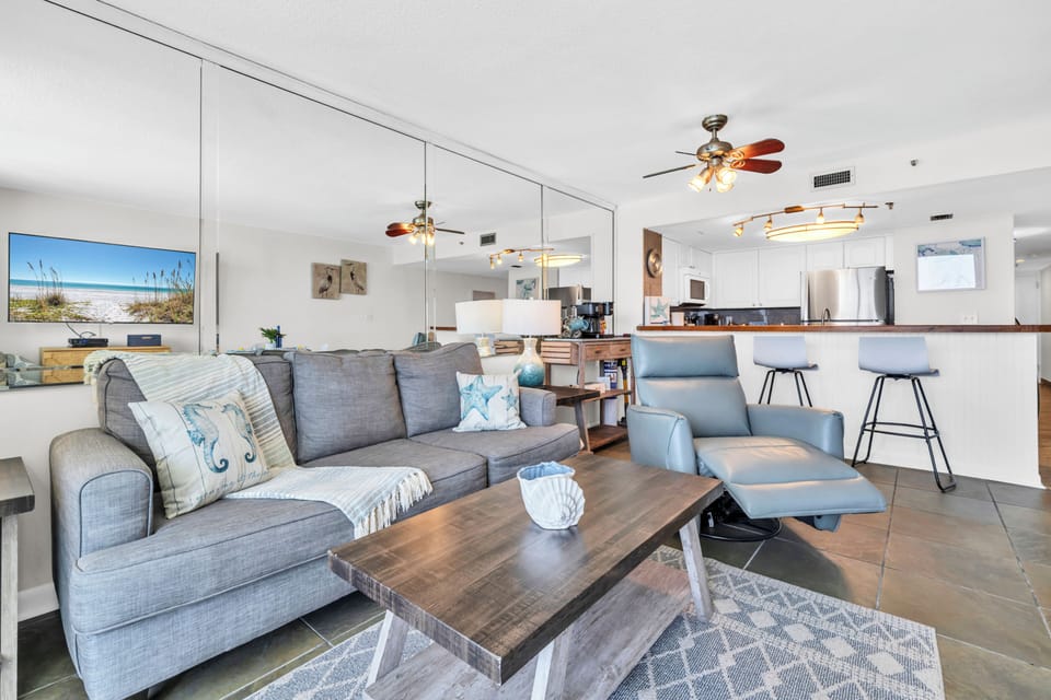 Unwind in your spacious coastal retreat, where modern comfort meets ocean-inspired style in an open living space.