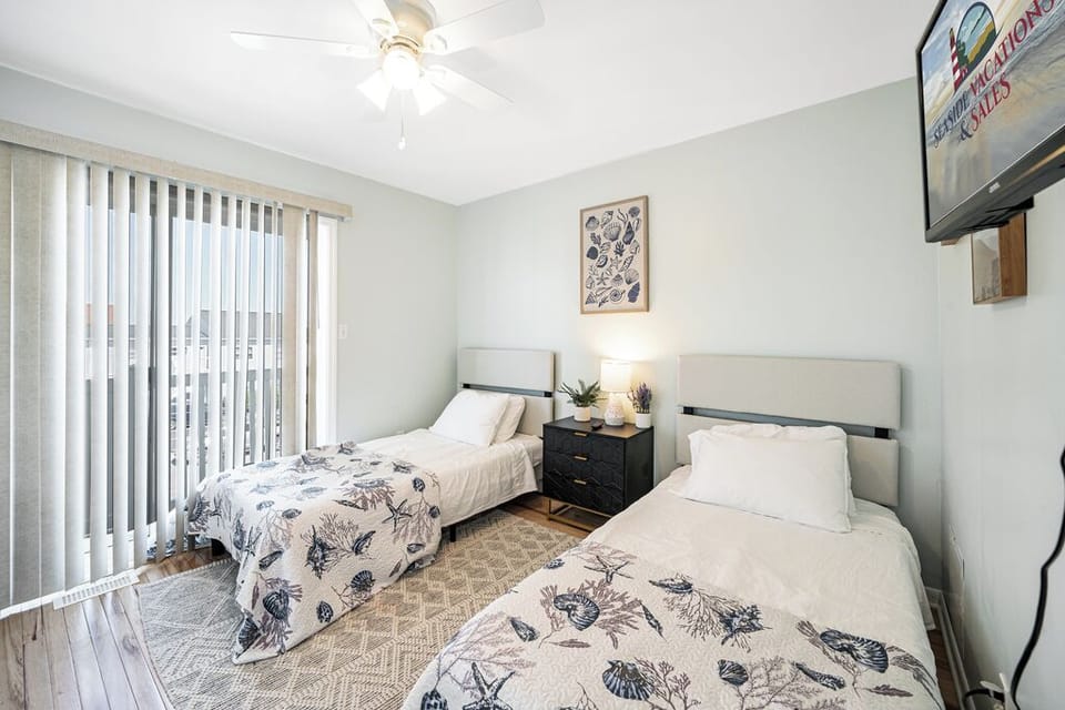 Bedroom 2 has 2 Twin Beds, and loads of natural lighting!