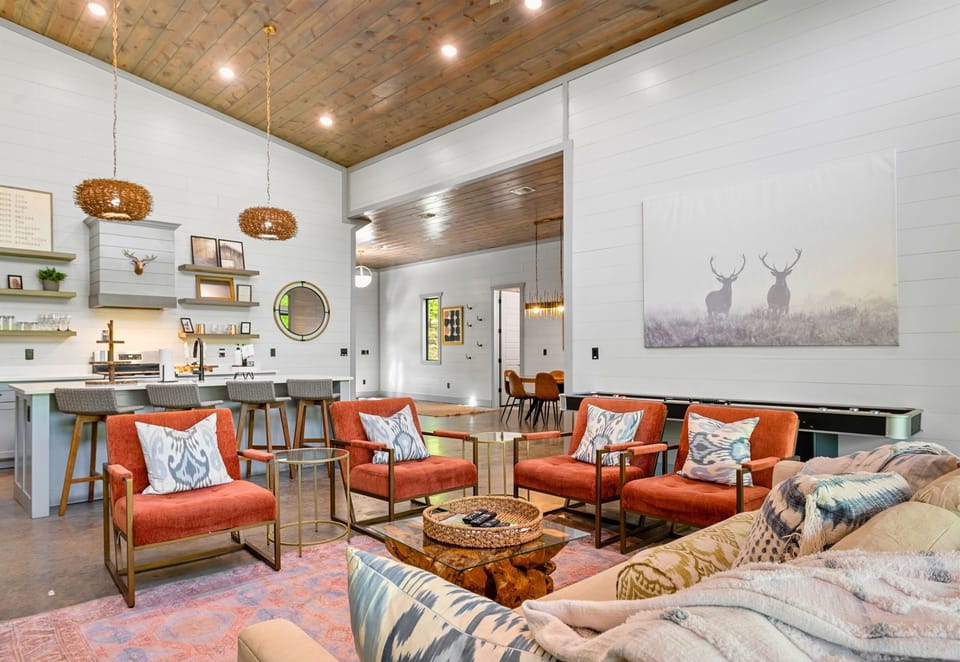 Spend quality time with loved ones in this open-concept living area, featuring plush seating, elegant décor, and a state-of-the-art entertainment system.