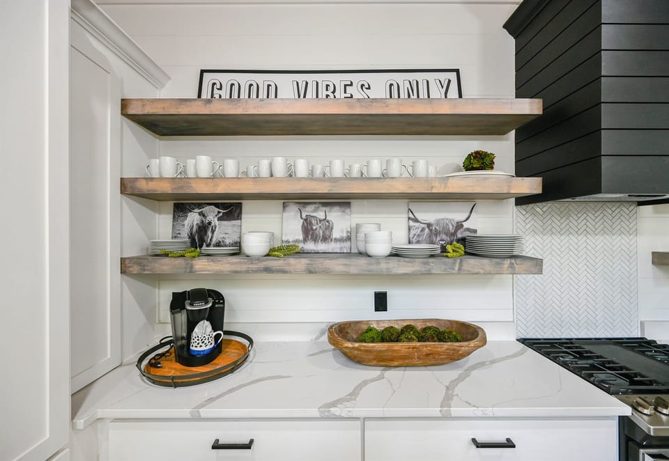 Start your morning with a cup of joe in our cozy kitchen, surrounded by modern touches and a dash of rustic appeal.