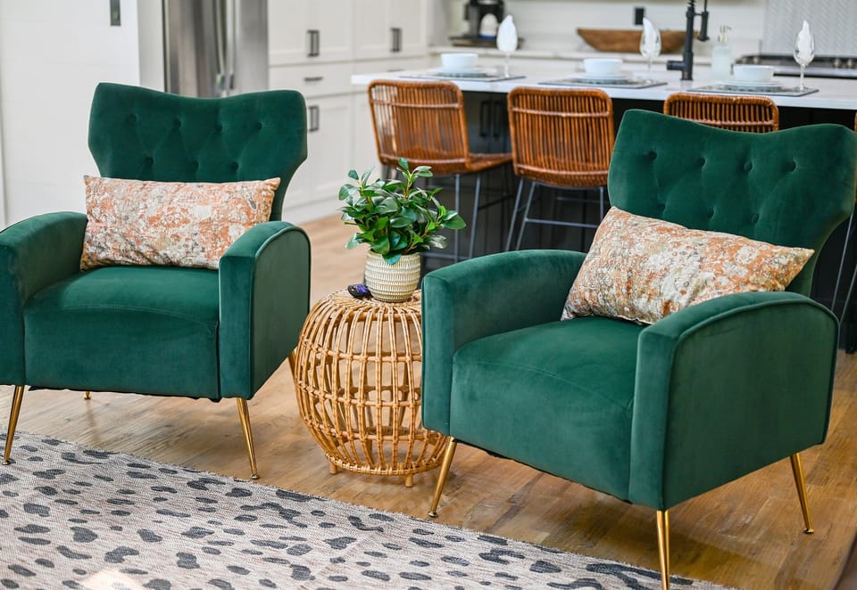 Cozy up with your favorite book in our vibrant velvet chairs, the perfect nook for relaxation and good vibes.