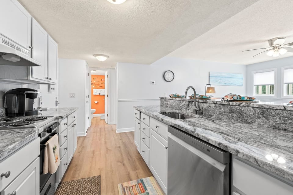 Newly remodeled kitchen with granite countertops and stainless steel appliances