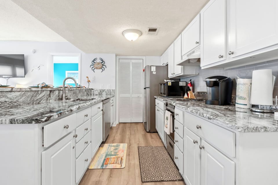 Newly remodeled kitchen with granite countertops and stainless steel appliances