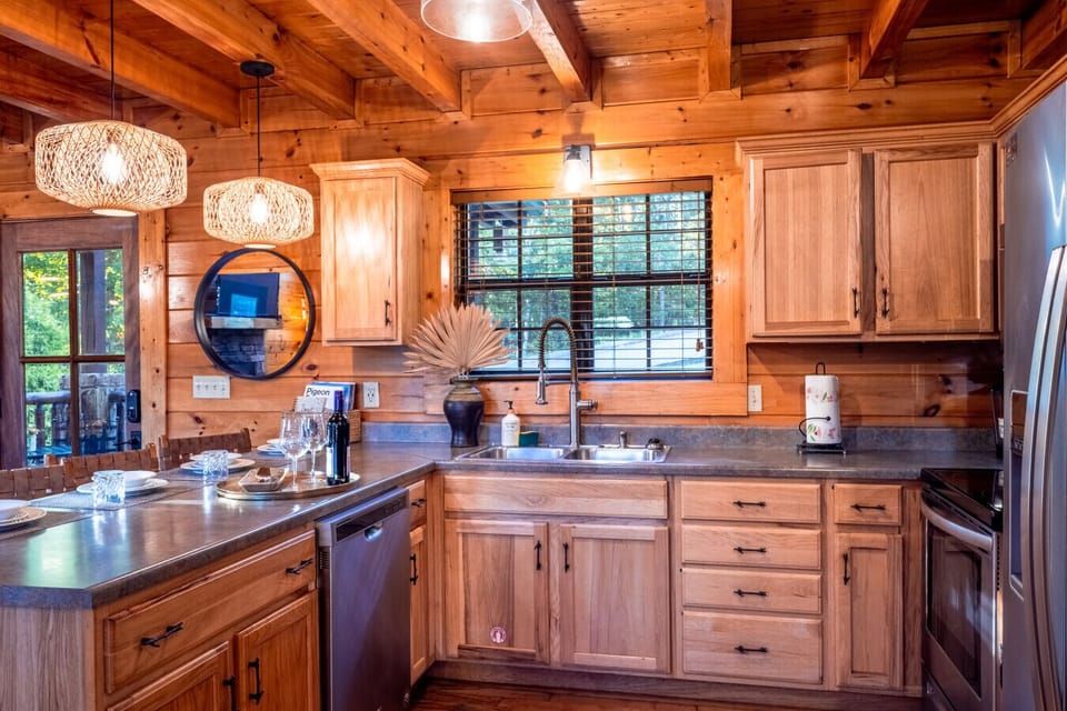 Spacious Kitchen | Large Island with Seating | Modern Lighting | Perfect for Family Meals |
